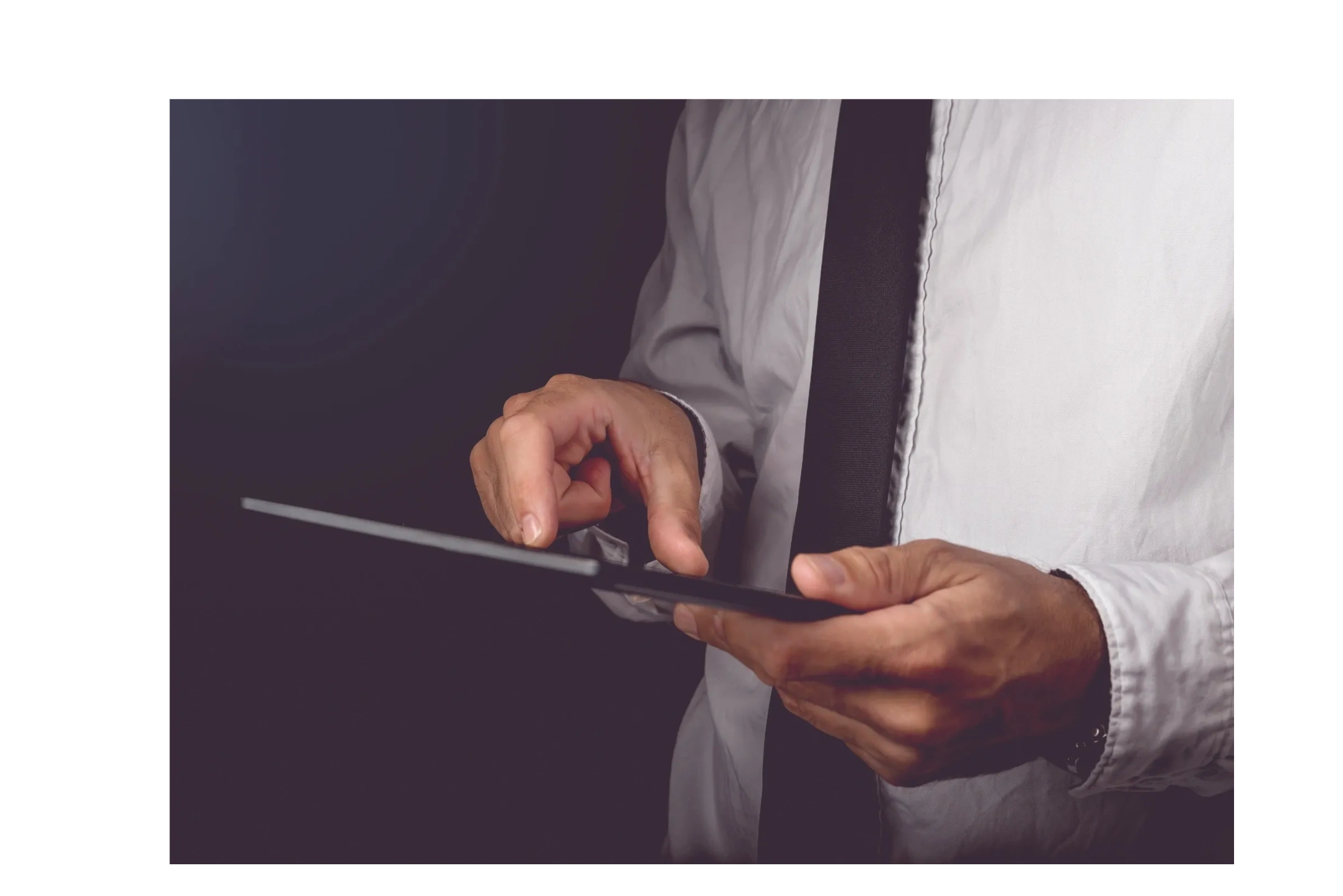 Hands holding tablet device